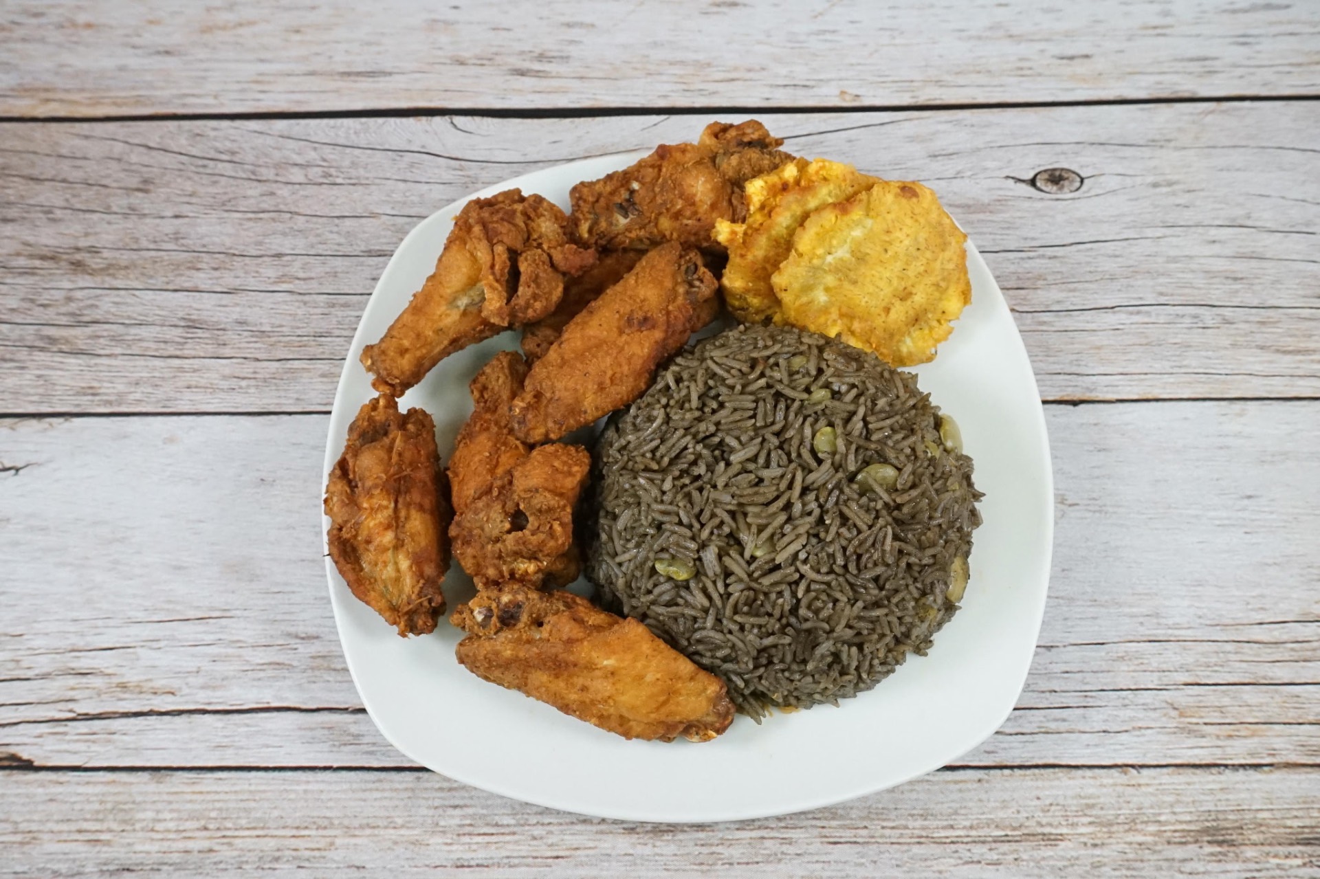 Wings with Haitian black rice djon djon